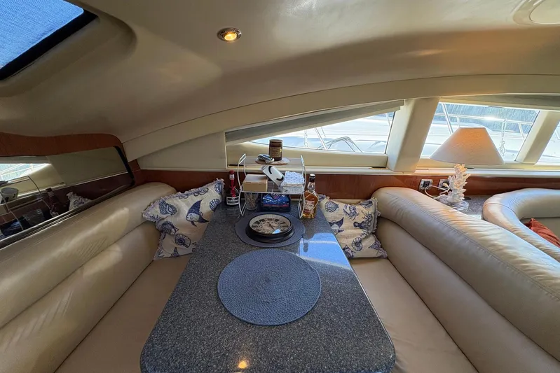 Andiamo II Yacht Photos Pics Luxurious interior of 2002 Sea Ray 480 Motor Yacht with elegant seating and decor.