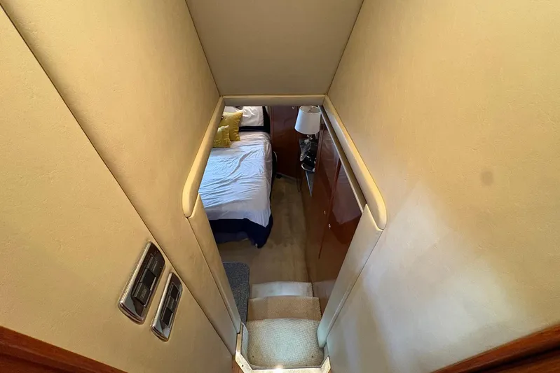 Andiamo II Yacht Photos Pics Stairway leading to a cozy bedroom in a 2002 Sea Ray 480 Motor Yacht.