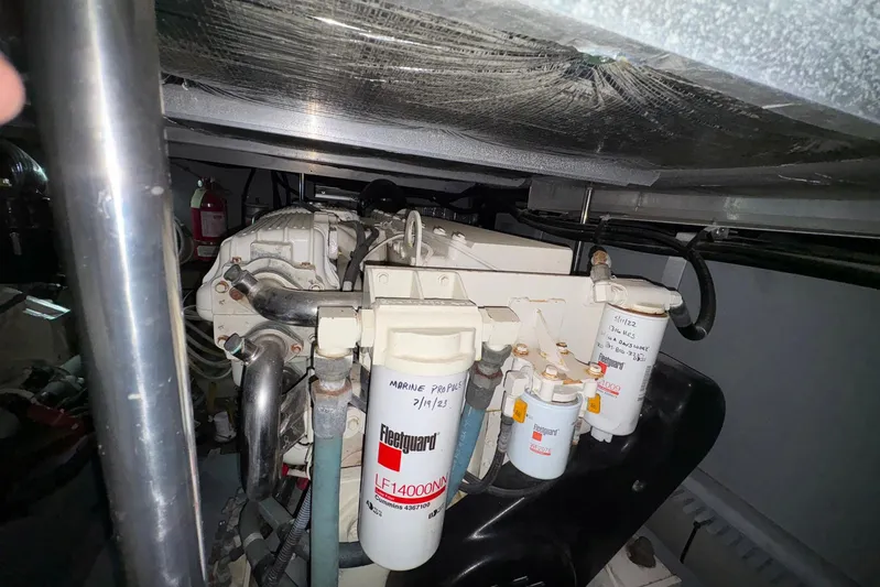 Andiamo II Yacht Photos Pics Engine room of 2002 Sea Ray 480 Motor Yacht with visible filters and components.