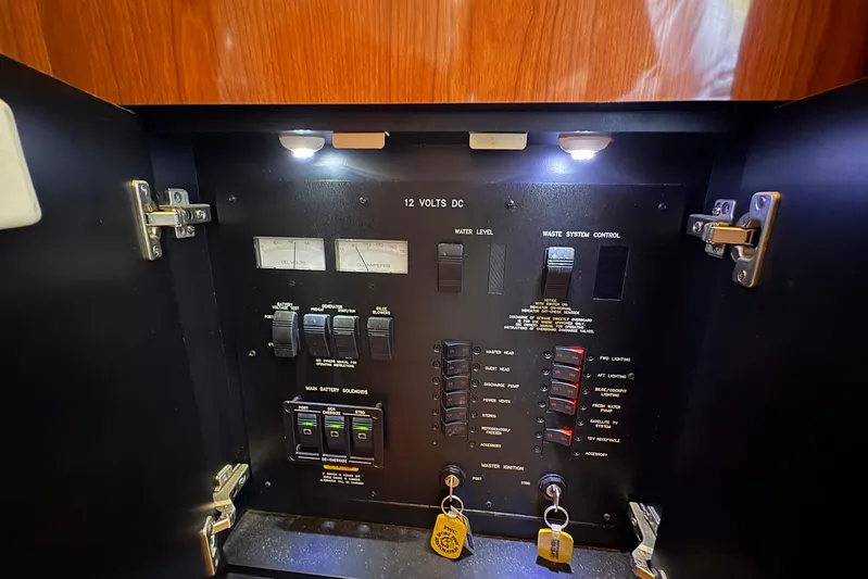 Andiamo II Yacht Photos Pics Control panel inside a 2002 Sea Ray 480 Motor Yacht, featuring switches and gauges.