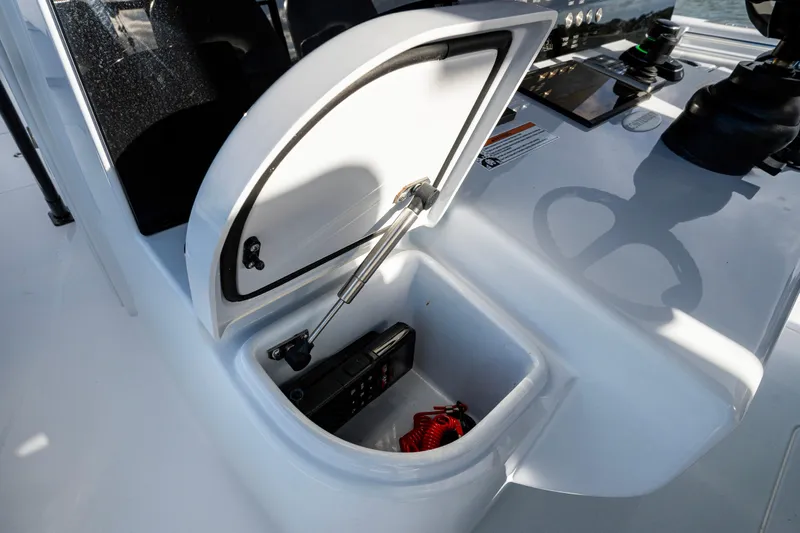  Yacht Photos Pics Open storage compartment on 2024 Contender 44 ST boat console.