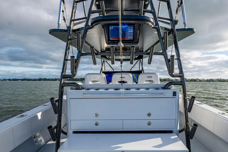  Yacht Photos Pics 2024 Contender 44 ST boat interior with advanced navigation system on open water.