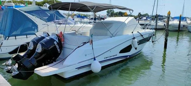  Yacht Photos Pics 2019 Jeanneau Cap Camarat 10.5 WA boat docked with twin Suzuki engines.