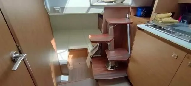  Yacht Photos Pics Interior of 2019 Jeanneau Cap Camarat 10.5 WA with wooden stairs and cabinetry.