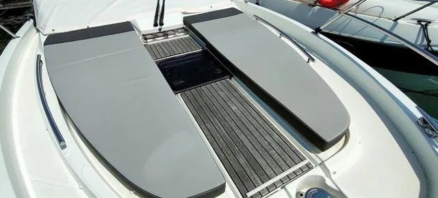  Yacht Photos Pics 2019 Jeanneau Cap Camarat 10.5 WA boat deck with cushioned seating and sleek design.
