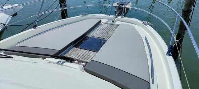  Yacht Photos Pics 2019 Jeanneau Cap Camarat 10.5 WA boat deck with cushioned seating and railing.
