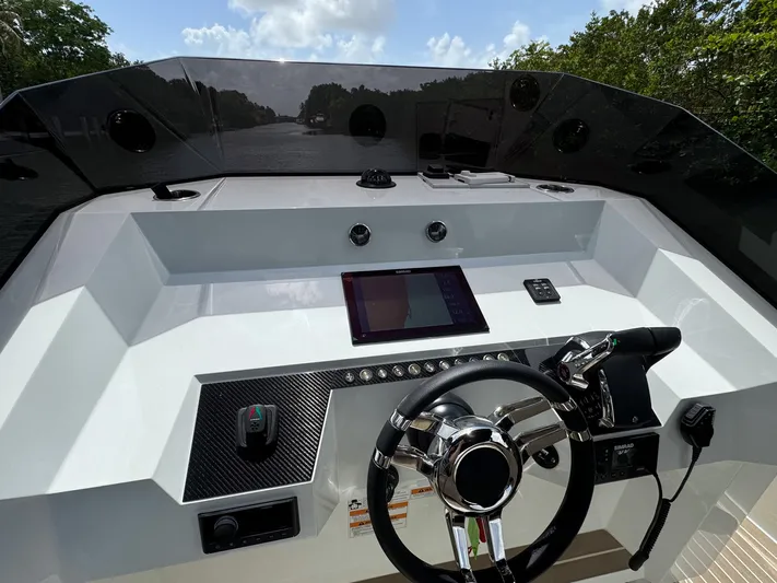  Yacht Photos Pics Helm of 2024 De Antonio Yachts D28 Open, featuring modern controls and navigation system.