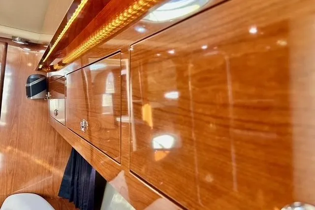  Yacht Photos Pics Luxurious wood interior of 2006 Regal Commodore 3560 yacht, featuring polished cabinetry.