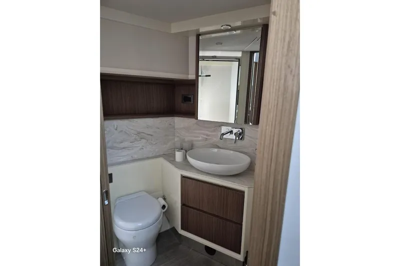  Yacht Photos Pics Luxurious bathroom in 2018 Absolute 52 FLY yacht with modern fixtures and elegant design.