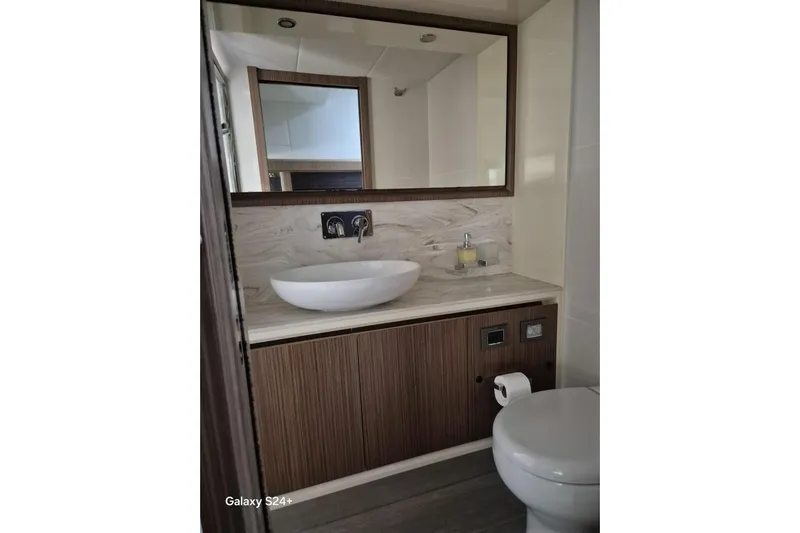  Yacht Photos Pics Luxurious bathroom in 2018 Absolute 52 FLY yacht with modern fixtures and elegant design.
