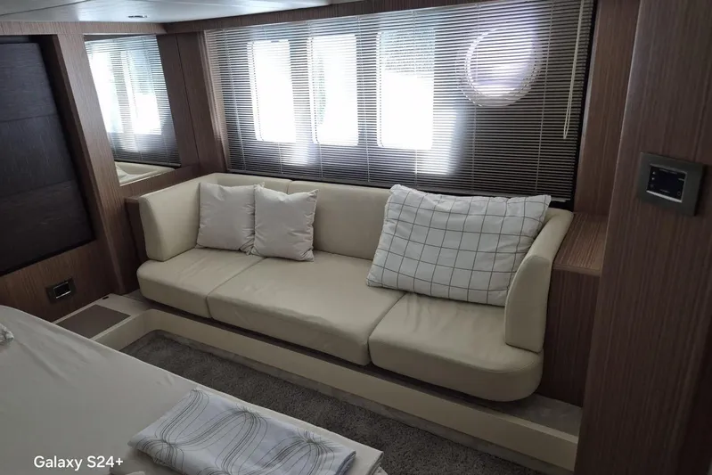  Yacht Photos Pics Luxurious interior of 2018 Absolute 52 FLY yacht with elegant sofa and cushions.