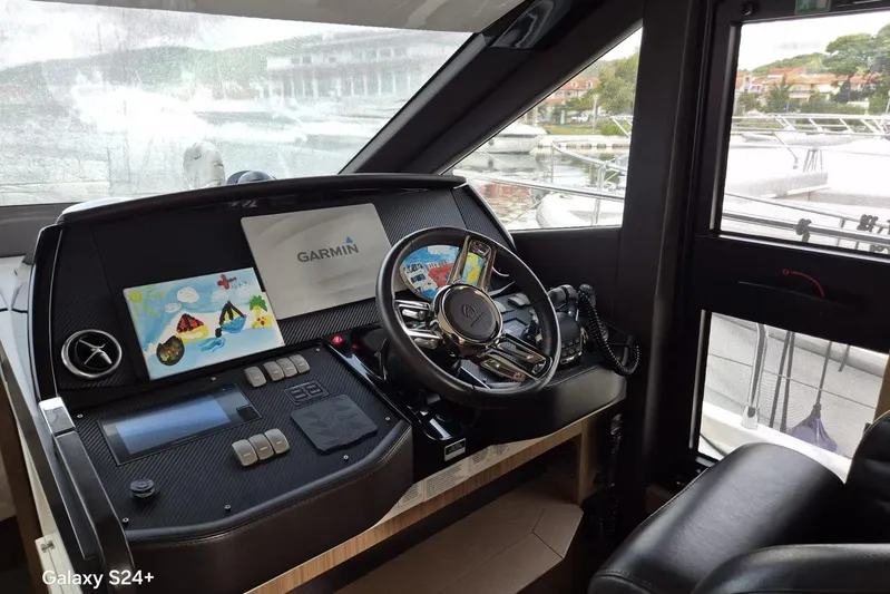  Yacht Photos Pics Cockpit of 2018 Absolute 52 FLY yacht with Garmin navigation system.
