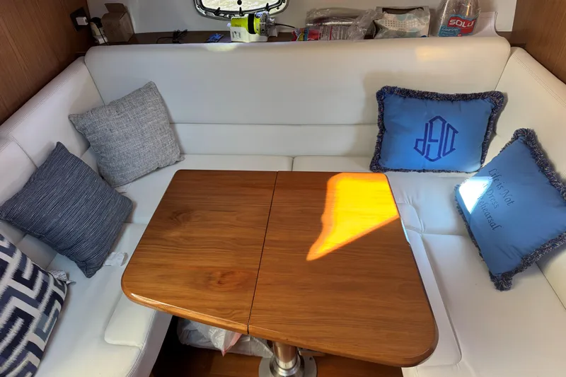  Yacht Photos Pics Luxurious interior of 2022 Tiara Yachts 43 Open with elegant seating and cushions.