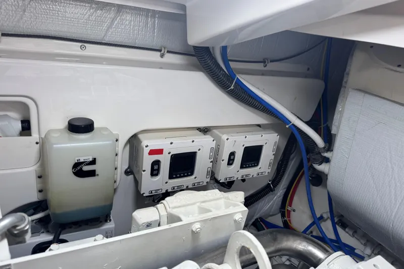  Yacht Photos Pics Engine room of 2022 Tiara Yachts 43 Open, featuring Cummins components and control panels.