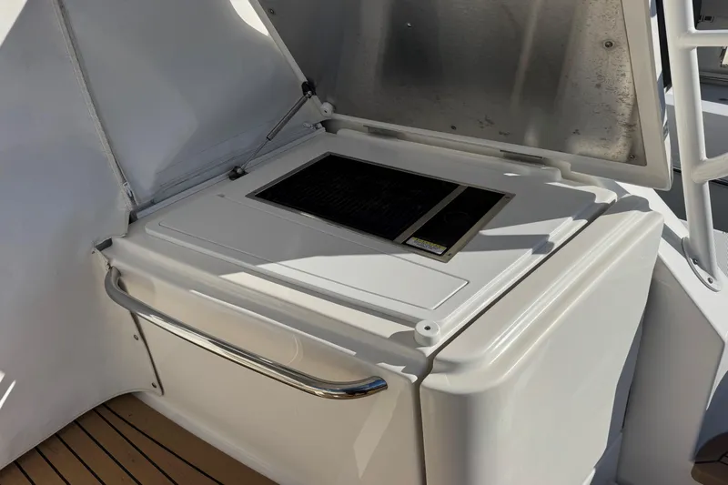  Yacht Photos Pics Outdoor kitchen area on 2022 Tiara Yachts 43 Open, featuring a built-in grill.