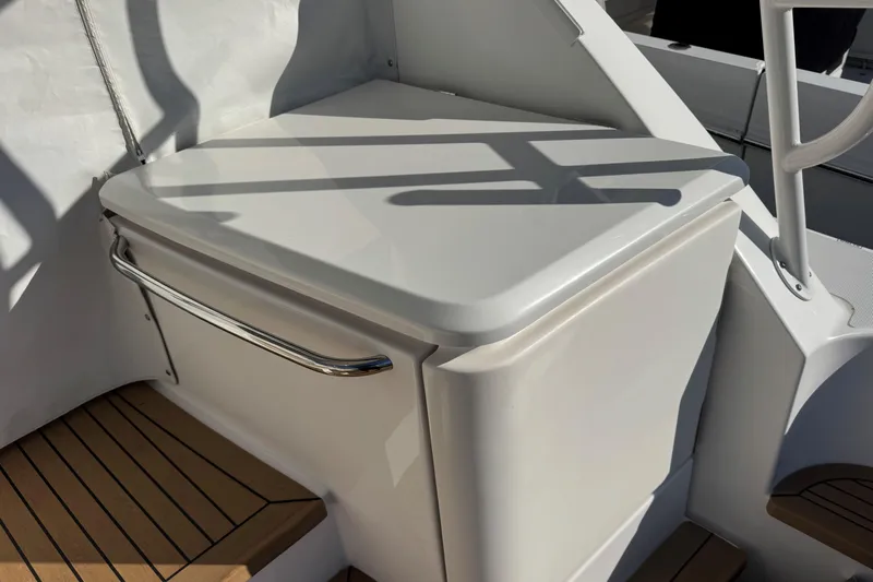  Yacht Photos Pics 2022 Tiara Yachts 43 Open, sleek white deck detail with stainless steel handle.