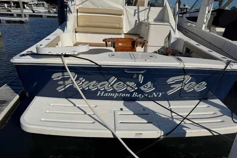  Yacht Photos Pics 2022 Tiara Yachts 43 Open docked in Hampton Bays, NY, with "Finder's Fee" name.