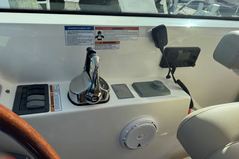  Yacht Photos Pics Control panel of 2022 Tiara Yachts 43 Open with throttle and communication equipment.