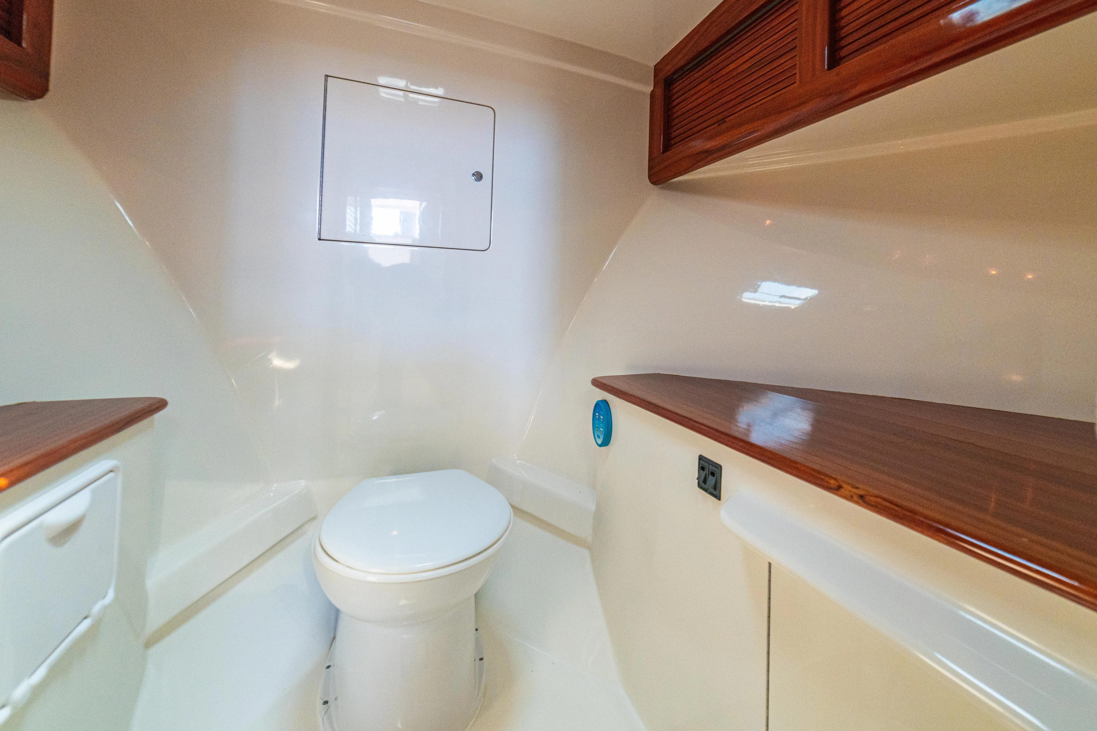 Pez Collector Yacht Photos Pics 2010 Custom Marcam 43 Convertible yacht bathroom with modern fixtures and wooden accents.