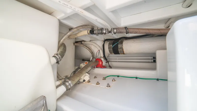 Pez Collector Yacht Photos Pics Engine compartment of 2010 Custom Marcam 43 Convertible boat with hoses and fittings.