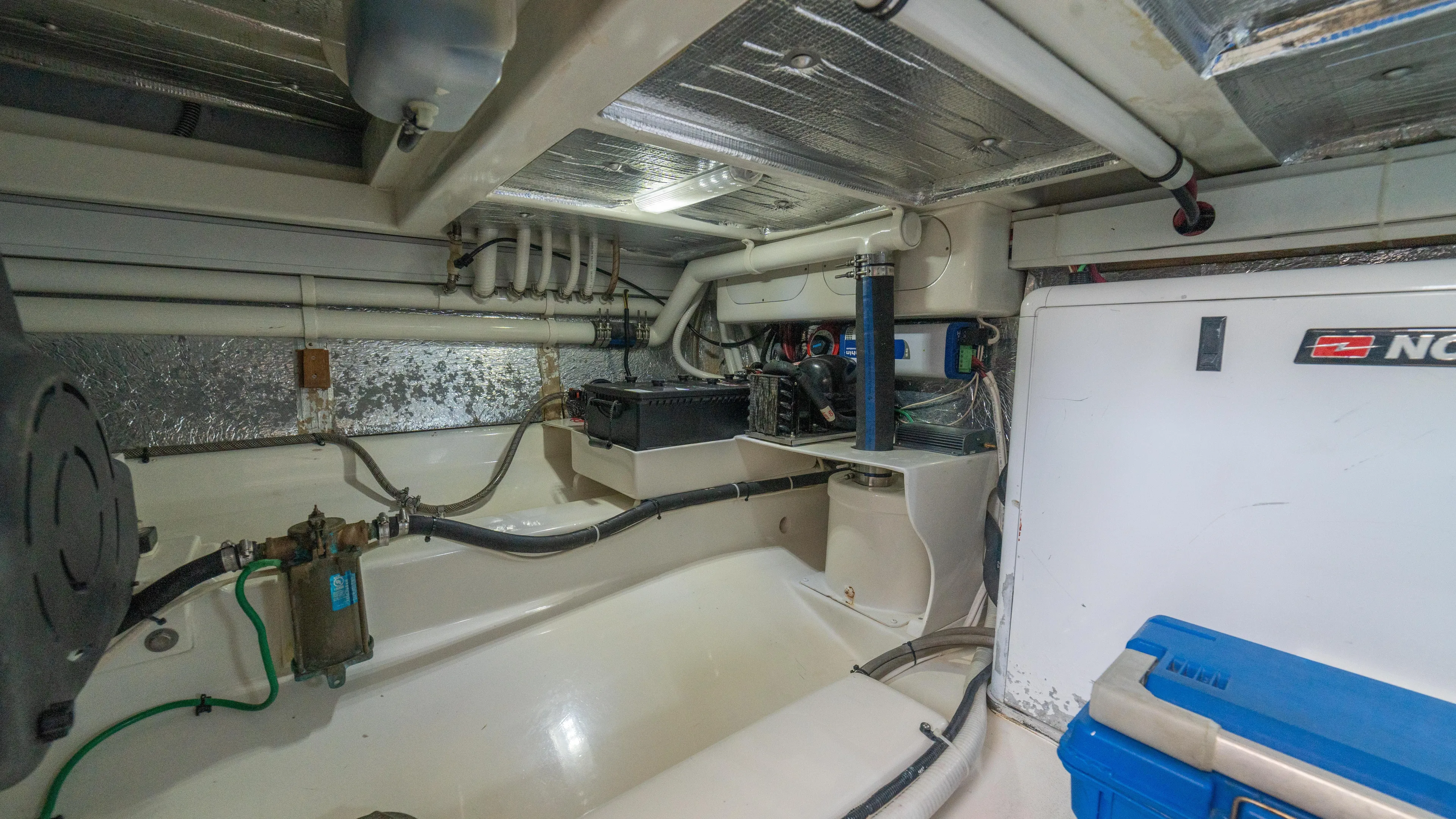 Pez Collector Yacht Photos Pics Engine room of a 2010 Custom Marcam 43 Convertible boat with visible wiring and equipment.