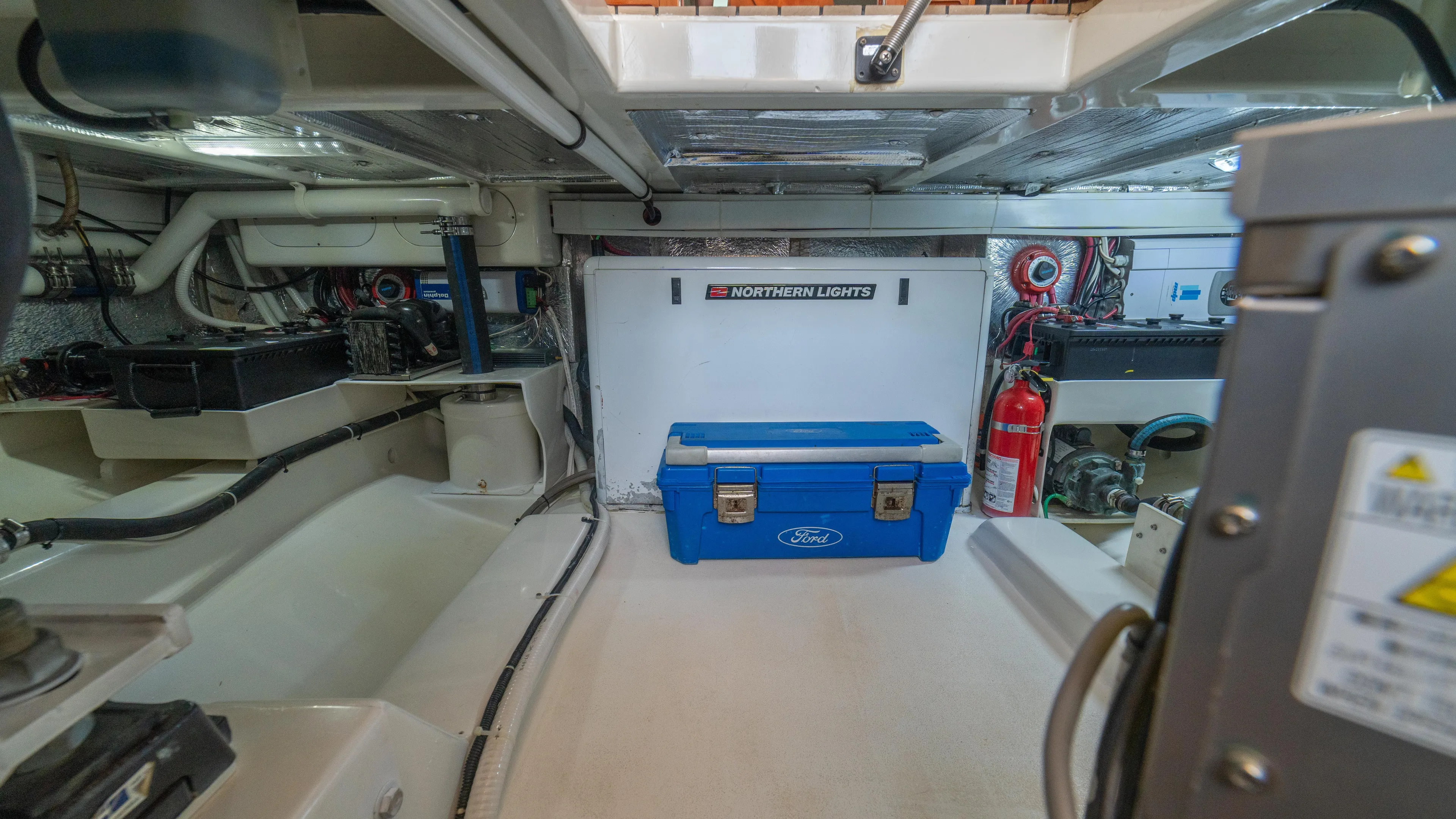 Pez Collector Yacht Photos Pics Engine room of a 2010 Custom Marcam 43 Convertible yacht with blue toolbox.