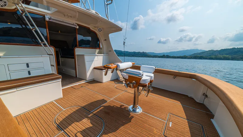 Pez Collector Yacht Photos Pics Spacious deck of 2010 Custom Marcam 43 Convertible yacht on a serene lake.