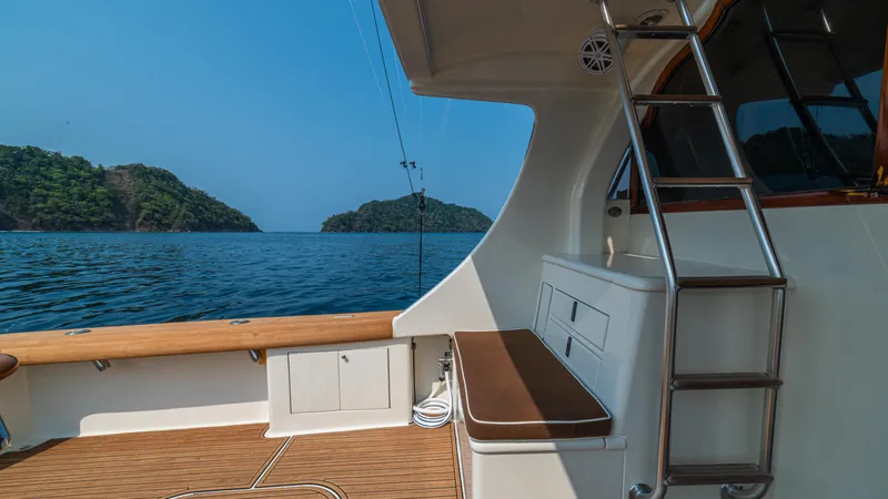 Pez Collector Yacht Photos Pics Custom Marcam 43 Convertible 2010 yacht interior with ocean view and island backdrop.