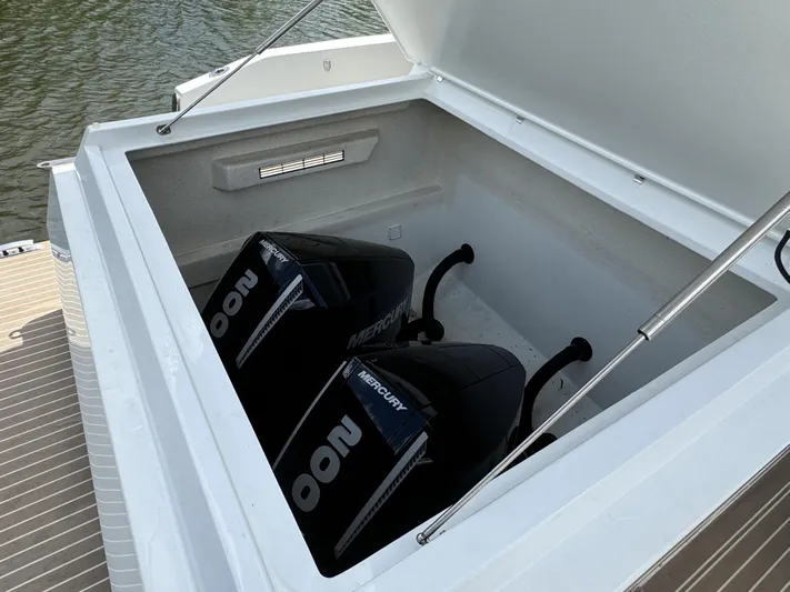  Yacht Photos Pics 2024 De Antonio Yachts D28 Open with dual Mercury outboard engines in storage compartment.