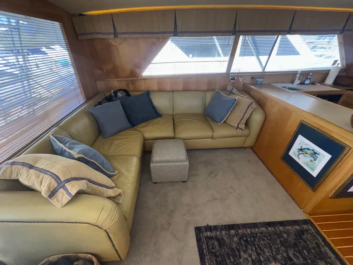 Hear After Yacht Photos Pics Interior of 1995 Bertram 50 Convertible yacht with cozy seating and decor.
