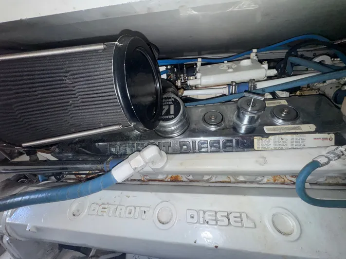 Hear After Yacht Photos Pics Engine compartment of a 1995 Bertram 50 Convertible with Detroit Diesel components.