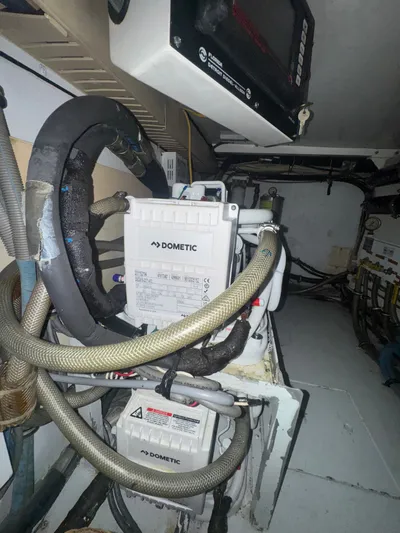 Hear After Yacht Photos Pics Engine room of 1995 Bertram 50 Convertible with Dometic equipment and wiring.