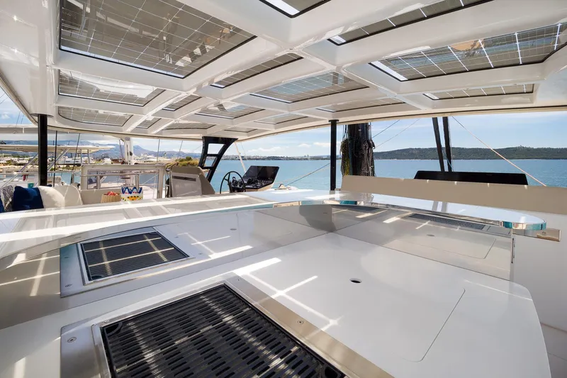 Dessus Yacht Photos Pics Luxurious Sunreef 60 yacht interior, 2022 model, featuring sleek design and panoramic windows.