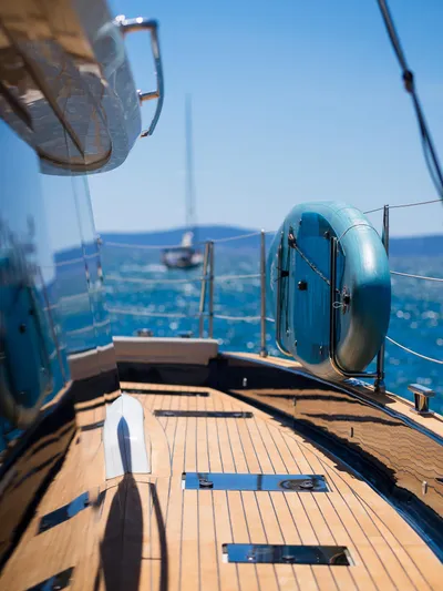 Dessus Yacht Photos Pics Luxury Sunreef 60 yacht deck, 2022 model, with ocean view and lifebuoy.