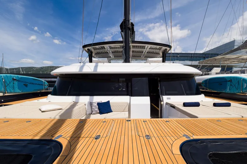 Dessus Yacht Photos Pics Luxury Sunreef 60 yacht, 2022 model, featuring spacious deck and modern design.