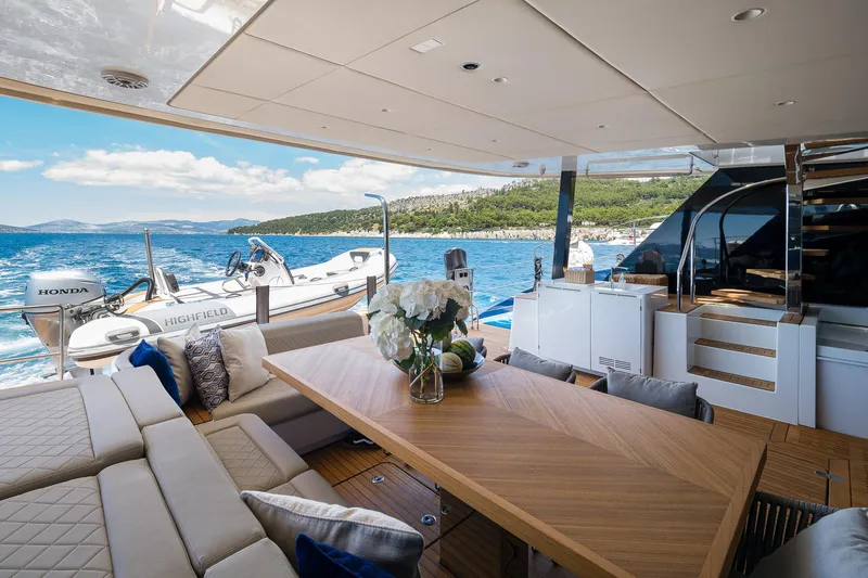 Dessus Yacht Photos Pics Luxurious Sunreef 60 yacht interior with elegant seating and ocean view, 2022 model.