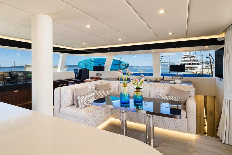 Dessus Yacht Photos Pics Luxurious interior of 2022 Sunreef 60 yacht with elegant seating and ocean view.
