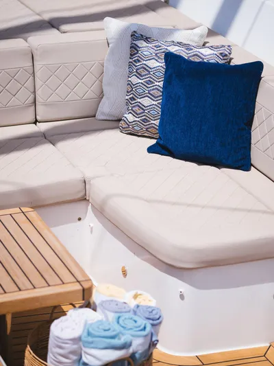 Dessus Yacht Photos Pics Luxurious Sunreef 60 yacht seating area with cushions and towels, 2022 model.