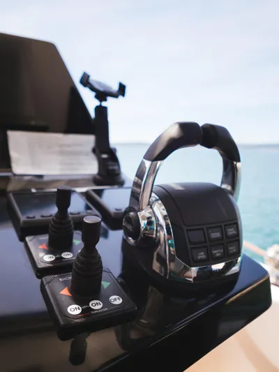 Dessus Yacht Photos Pics Control panel of a 2022 Sunreef 60 yacht with ocean view.