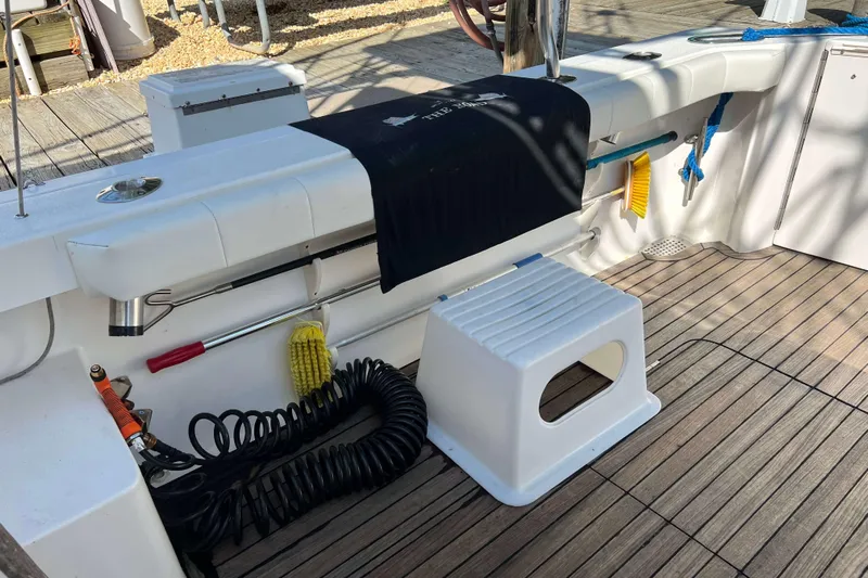  Yacht Photos Pics 2007 Henriques 42 Express boat deck with cleaning tools and accessories.