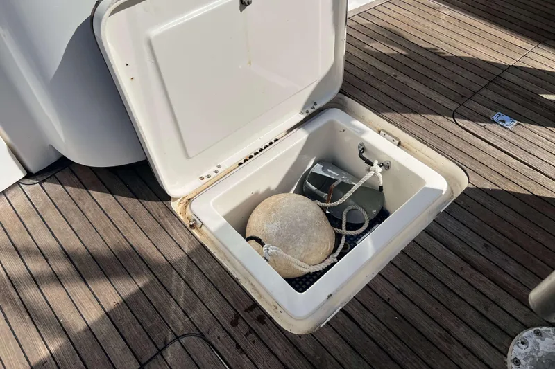  Yacht Photos Pics Open storage compartment on 2007 Henriques 42 Express boat deck with equipment inside.