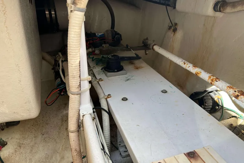  Yacht Photos Pics Engine compartment of a 2007 Henriques 42 Express boat, showing pipes and machinery.