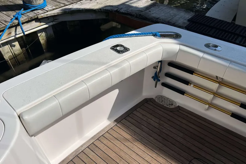  Yacht Photos Pics 2007 Henriques 42 Express boat interior with cushioned seating and rod holders.