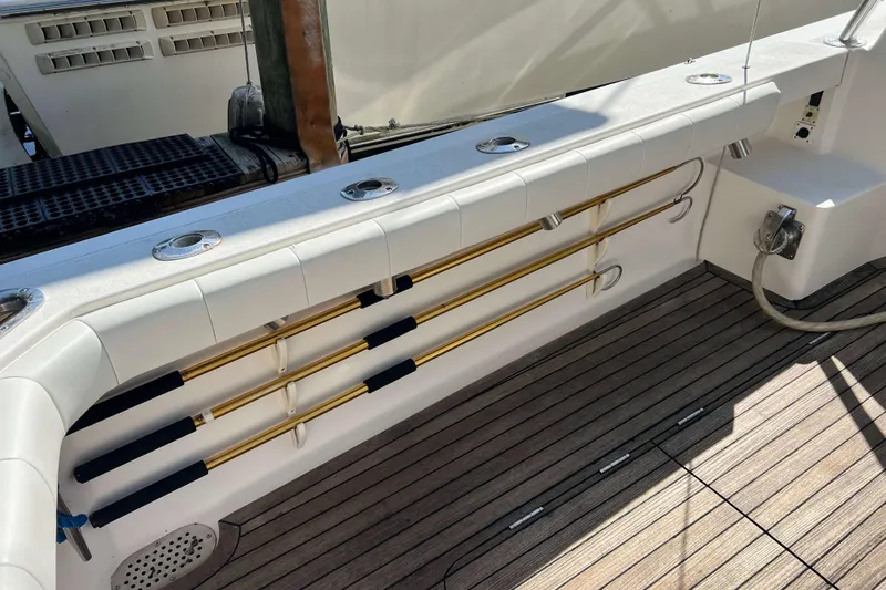  Yacht Photos Pics Henriques 42 Express 2007 boat deck with rod holders and teak flooring.