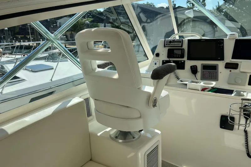  Yacht Photos Pics Interior of a 2007 Henriques 42 Express boat with helm station and captain's chair.