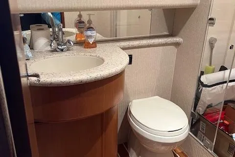  Yacht Photos Pics Bathroom interior of 2007 Henriques 42 Express yacht with sink and toilet.