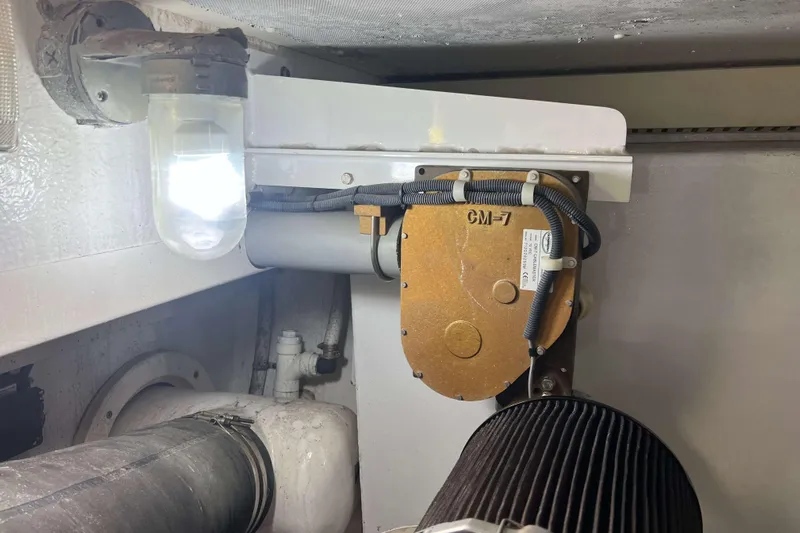  Yacht Photos Pics Engine room of 2007 Henriques 42 Express with mechanical components and lighting.