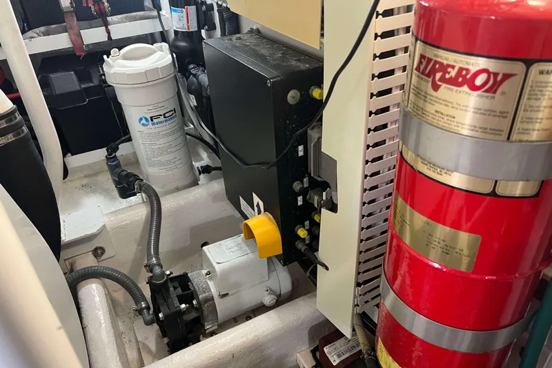  Yacht Photos Pics Engine room of 2007 Henriques 42 Express with fire extinguisher and water filtration system.