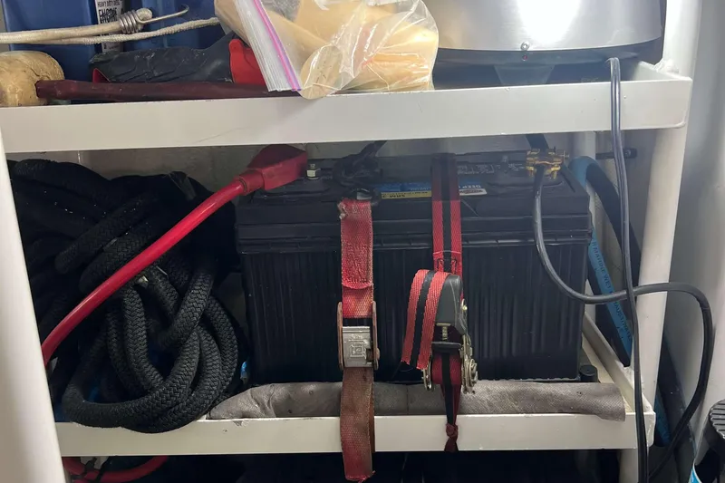  Yacht Photos Pics Battery storage area on a 2007 Henriques 42 Express boat with cables and straps.