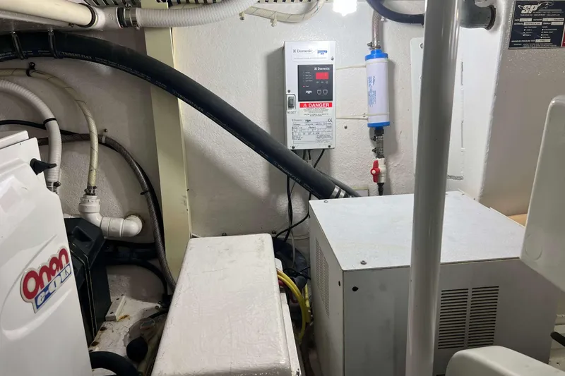  Yacht Photos Pics Engine room of a 2007 Henriques 42 Express boat, featuring various equipment and wiring.